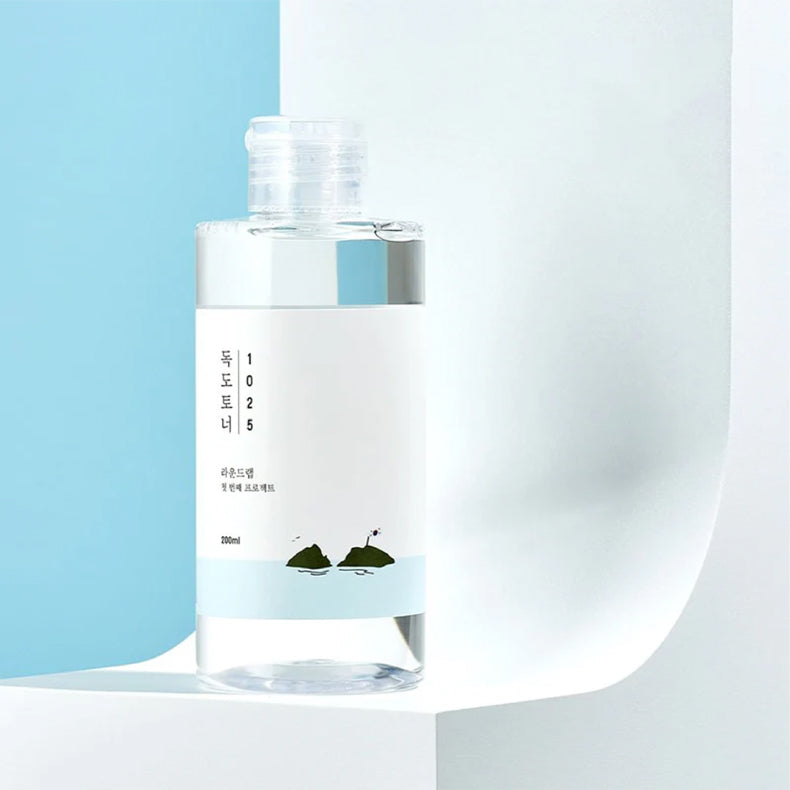 Round Lab 1025 Dokdo Toner bottle, minimalist design against a blue and white background.