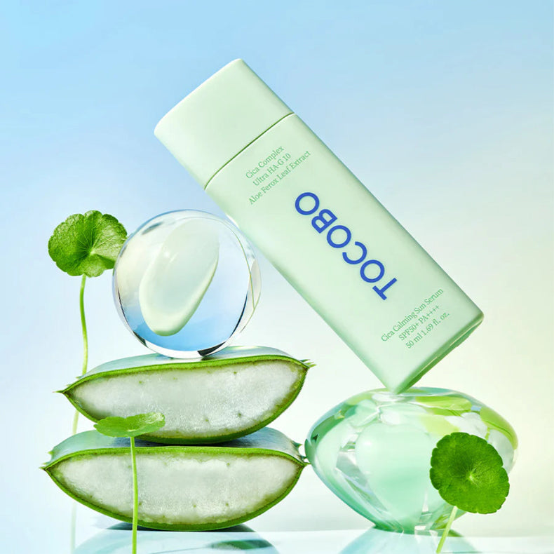 TOCOBO Cica Calming Sun Serum SPF50 bottle with aloe vera and centella leaves, promoting soothing and hydration